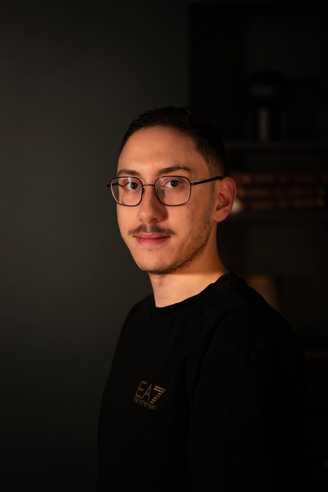 Professional headshot of Nader Alhamwi in formal attire